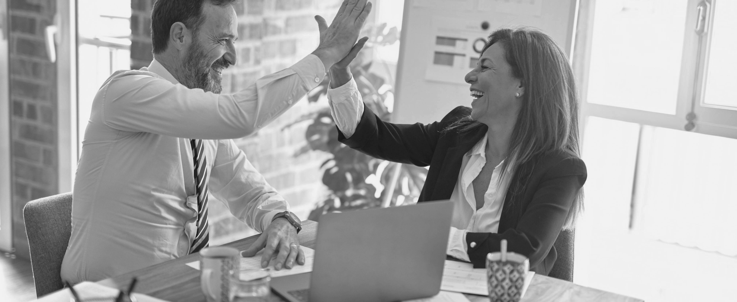 two people high-fiving